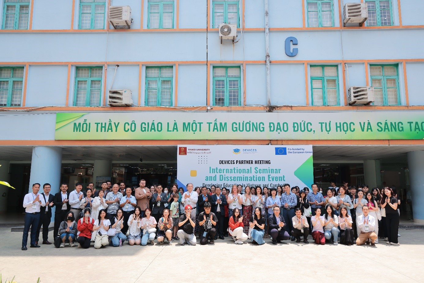 A group of people posing for a photoAI-generated content may be incorrect.