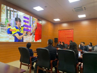 A group of people in a room with a large screenAI-generated content may be incorrect.