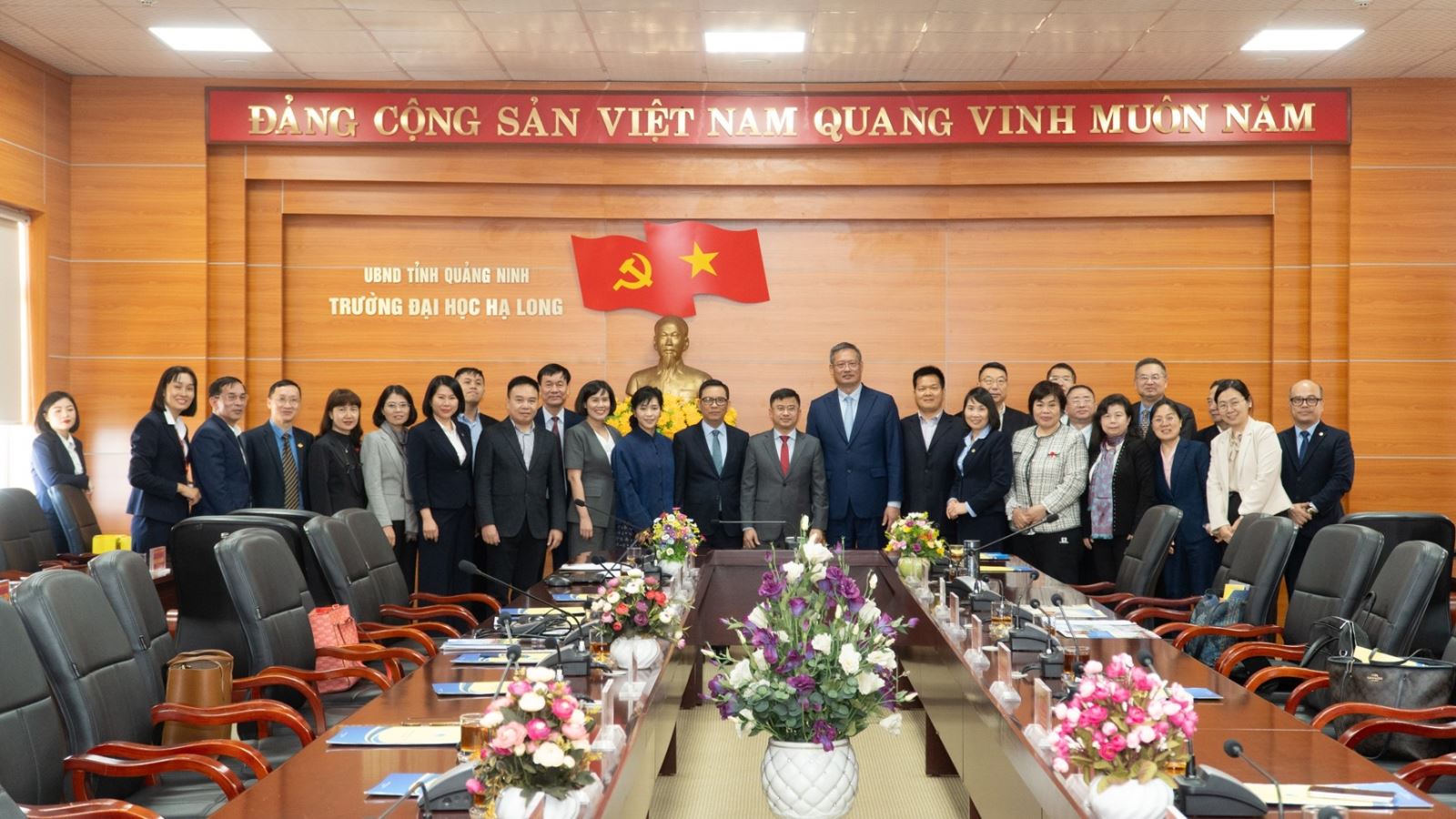 A group of people sitting at a tableAI-generated content may be incorrect.